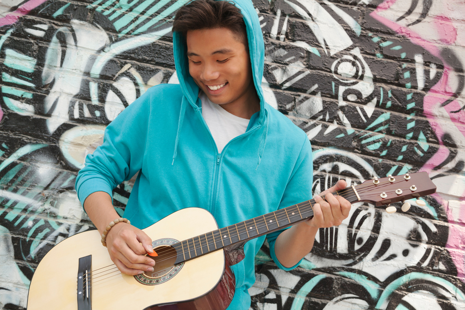 Young smiling street musician 