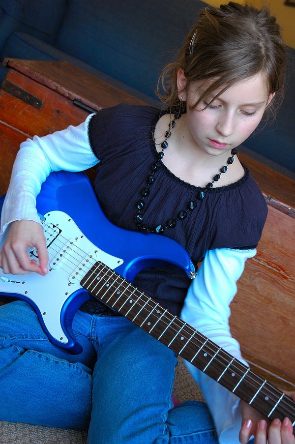 Young Teen Playing Electric Guitar