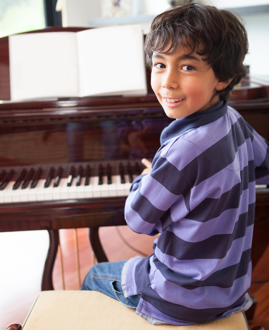 Boy Playing a Piano